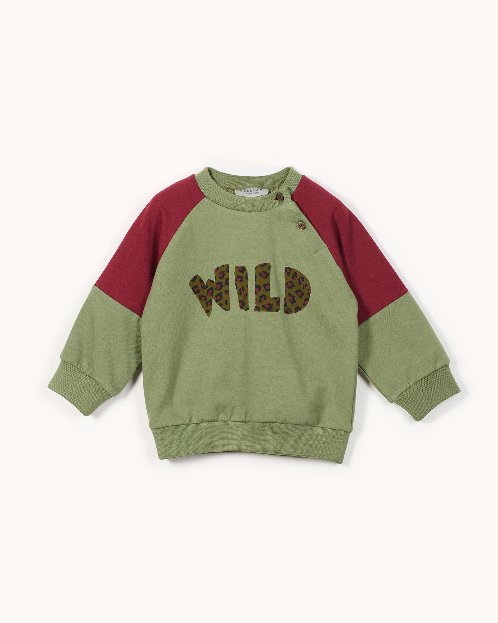 Green and red sweatshirt with 'WILD' print on a white background