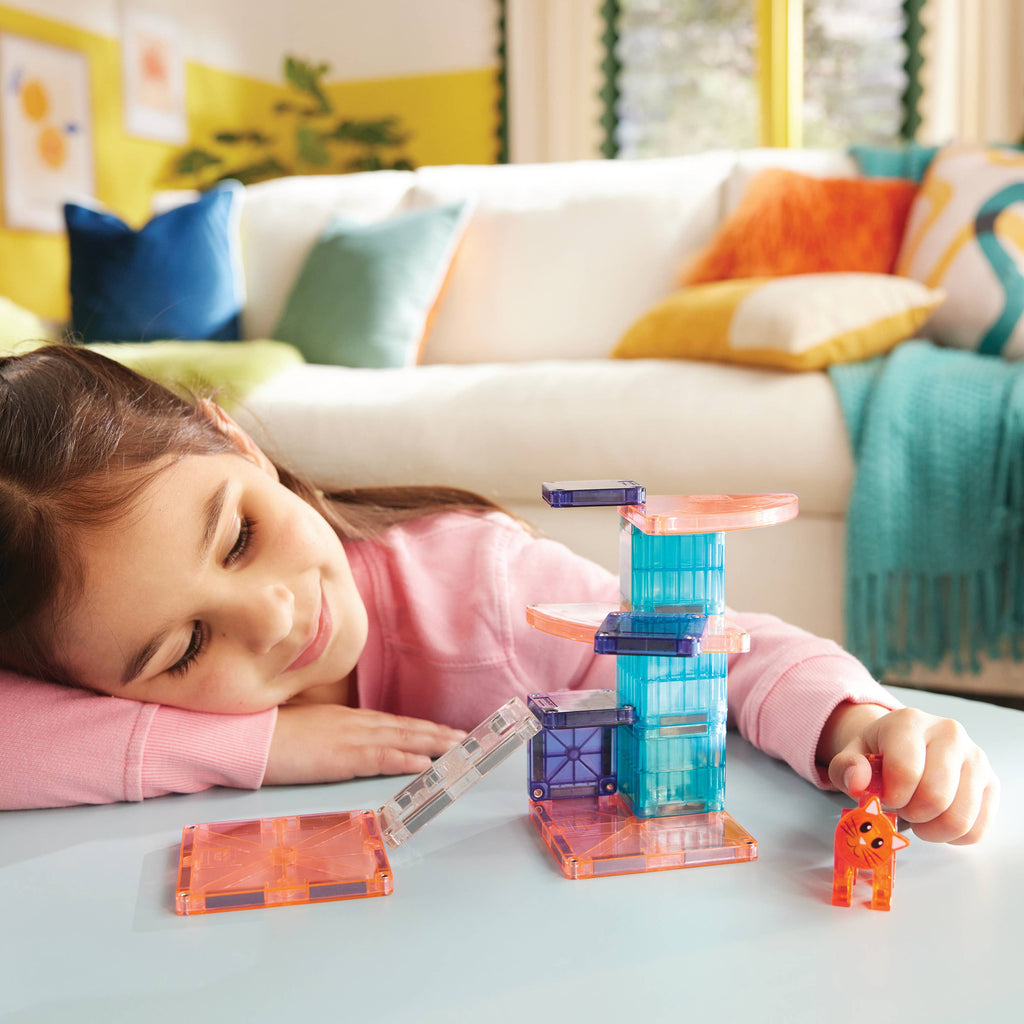 Kid playing with her new pet cat with our MAGNA-TILES® Cat Tree – 13-Piece Magnetic Building Set
