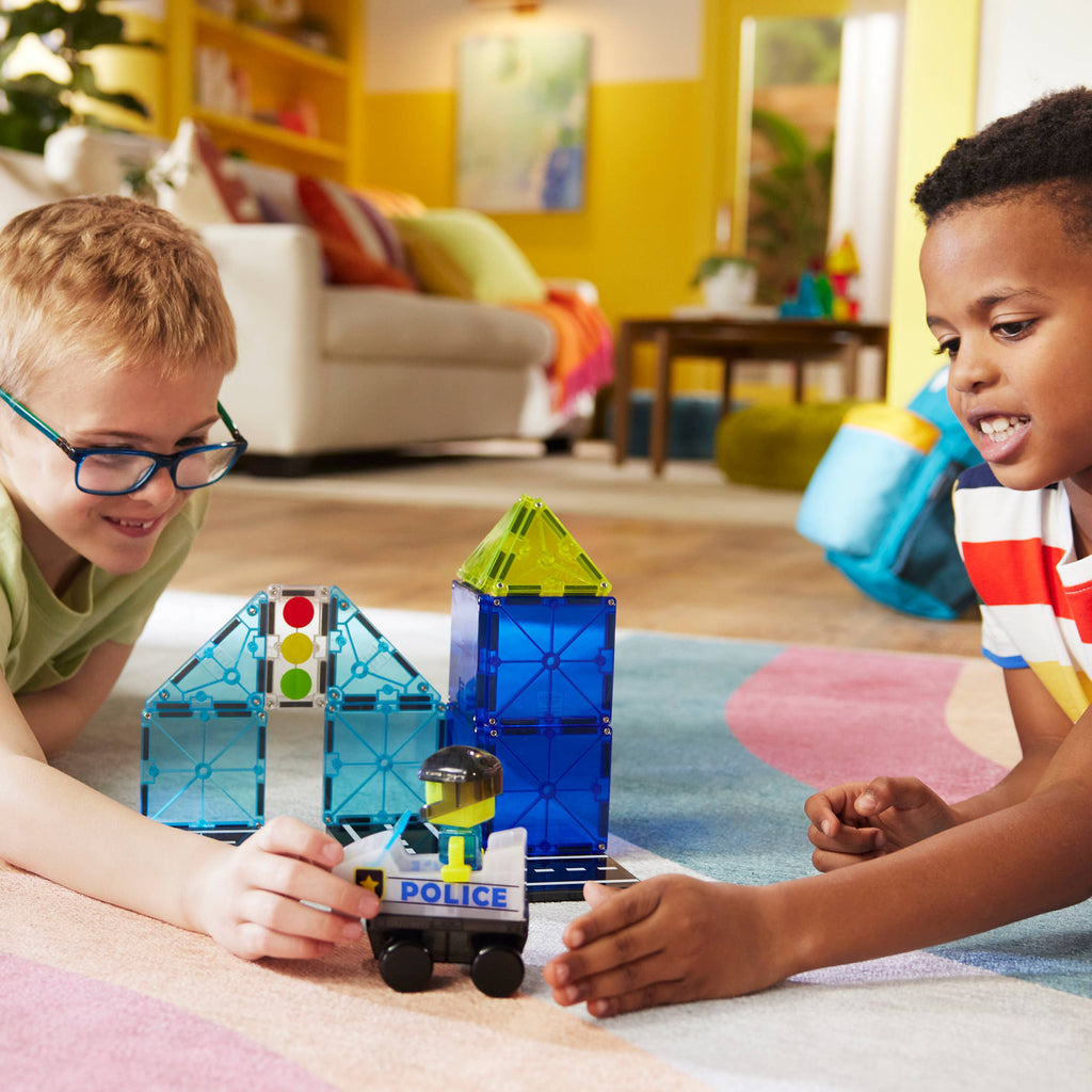 Kids using their imaginations to catch and arrest the bad guys with our MAGNA-TILES® Police Patrol – 20-Piece Magnetic Building Set!