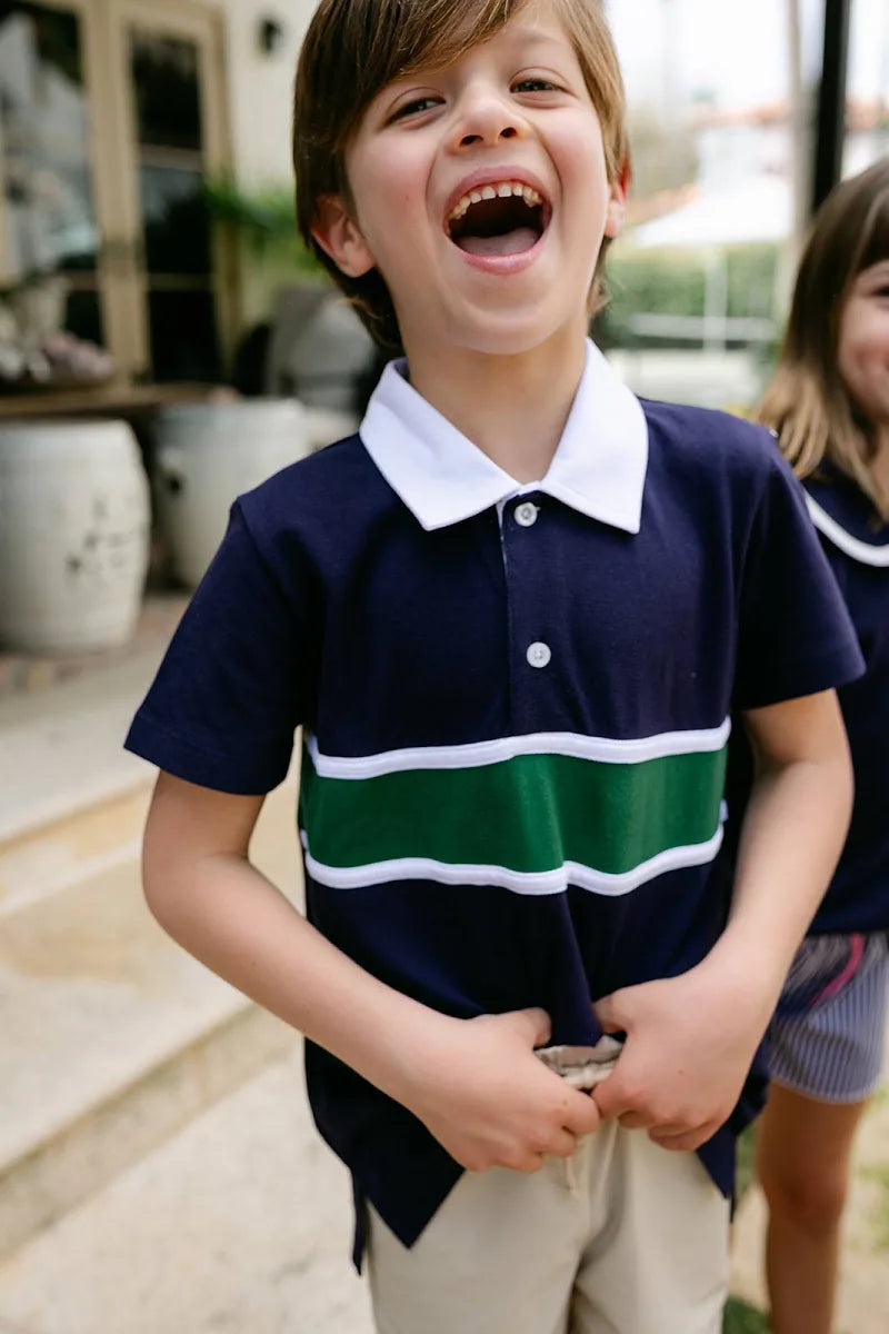 Our navy kid’s polo with white + green stripes by Little Paper Kids is a must-have for back-to-school, dressing up for photos, or hitting the course with the parents!